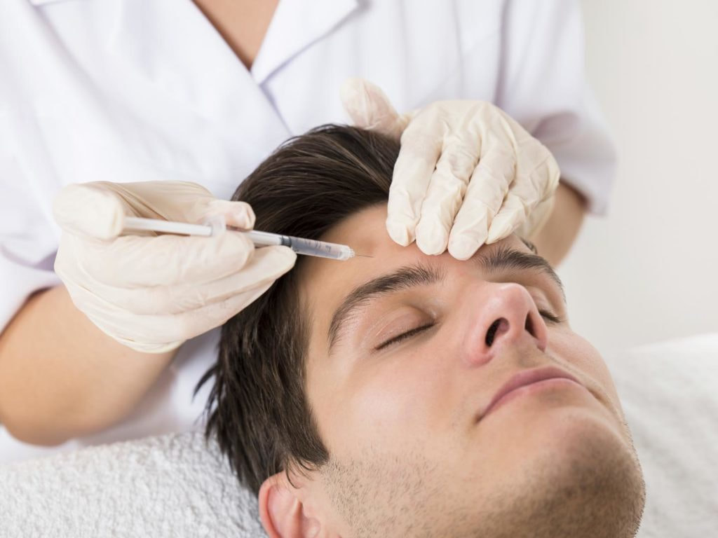A Male customer undergoing Botox and Juvederm treatment